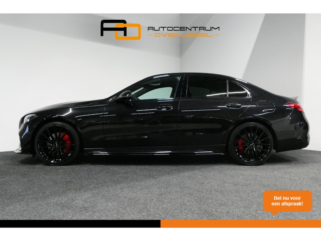 Mercedes-Benz C-klasse 300 e AMG Line / C63S AMG Diffuser / Brabus Grille / Maxton Design Bodykit V.2 / Elektr. verstelbare voorstoelen + memory / Digital Light (Laser) / Rondomzichtcamera / Apple Carplay - Android Auto / Ambienteverlichting / 20'' LMV / Stoelverwarming / Dodehoekdetectie / Achteruitrijcamera / Draadloze telefoonlader / Cruise Control