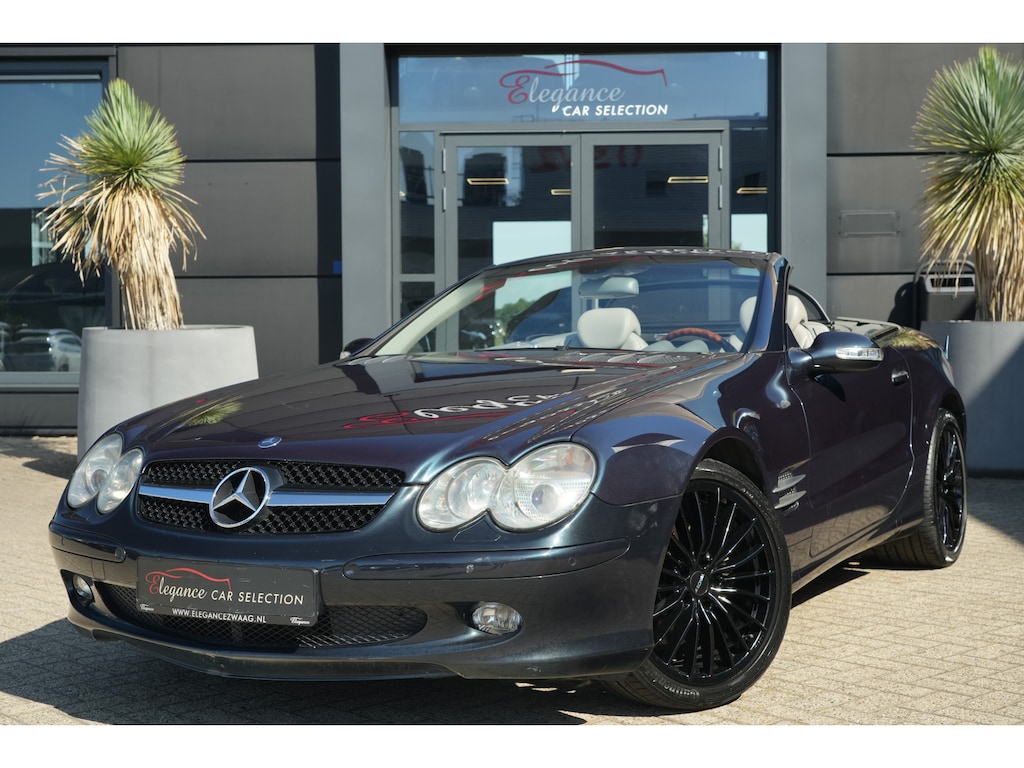 Mercedes-Benz SL 500 | 306PK | Designo | Bose | Leder | Stoelverwarming | 19" | Mercedes-Benz SL-Klasse 500 306 PK met 5.0 V8 benzinemotor, Designo lak, Bose audiosysteem, navigatie, 19-inch lichtmetalen velgen, lederen interieur, elektrisch verstelbare stoelen met geheu