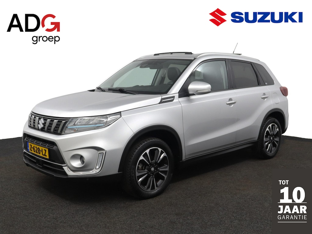 Suzuki Vitara 1.4 Boosterjet Style Smart Hybrid | Climate control | Cruise control adaptive | Navigatie | Apple car play, Android auto | Stoelverwarming | Trekhaak | Panoramadak |