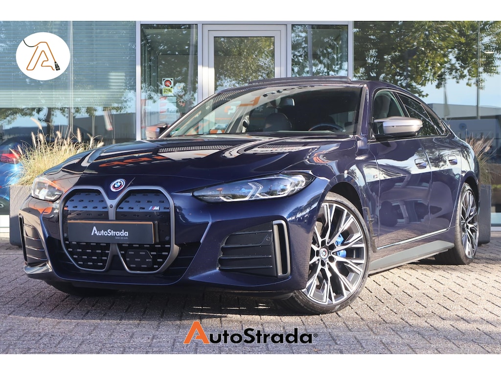 BMW i4 (g26) M50 544pk M-Sport SoH 94% | Tansanietblau | Pano | 360 CAM | Laser | Harman/Kardon | Trekhaak |