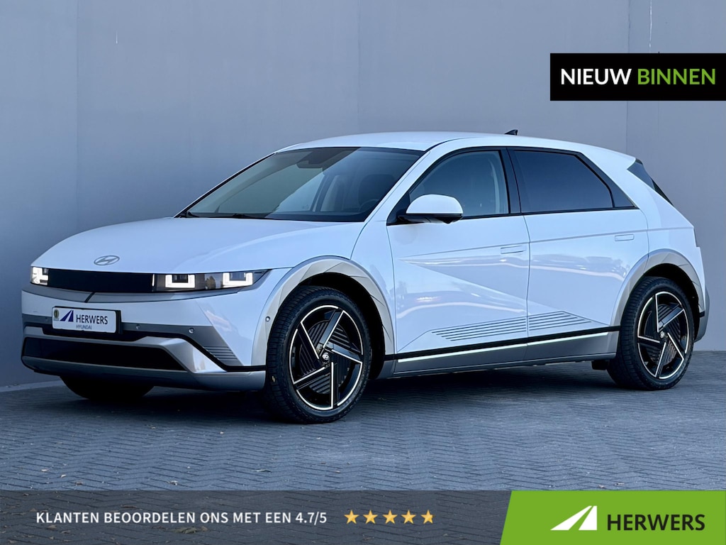 Hyundai Ioniq 5 Lounge 84 kWh / SOH 97,3% / CCS snelladen / Head Up Display / Warmtepomp / Trekgewicht 1600 kg / Elektrische achterklep / Stuur- Stoel & Achterbank verwarming / Rondomzicht camera / Bose Audio Systeem / Adaptief cruise control /