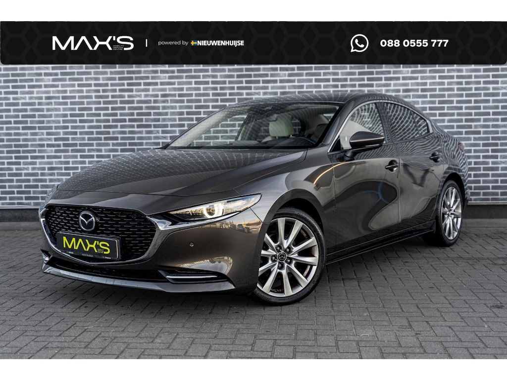 Mazda 3 2.0 e-SkyActiv-X M Hybrid 180 Luxury | Wit Lederen Bekleding | Head-up Display | 360 Graden Camera | Parkeersensoren | Lichtmetalen Velgen 18 inch | Keyless Entry | Stoelverwarming | LED Koplampen | Cruise Control Adaptief | Dodehoekdetectie | Navigatie | Apple Carplay | Android Auto