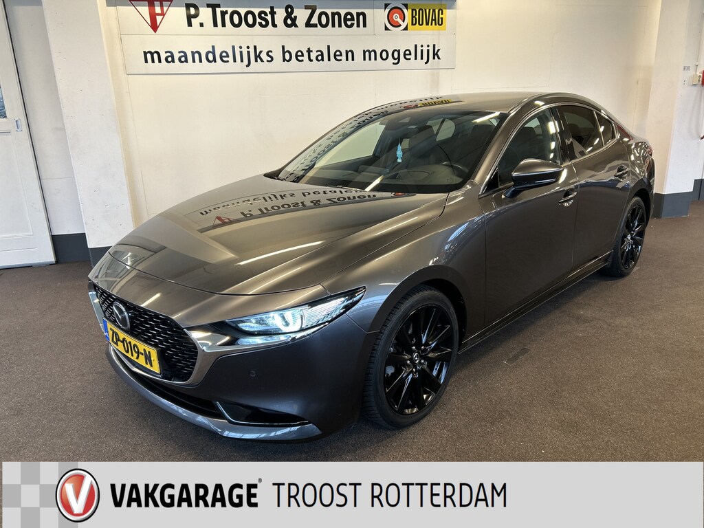 Mazda 3 2.0 e-SkyActiv-G M Hybrid 122 Luxury | Adaptieve cruise control | Stoel+Stuurverwarming | Head up display | Keyless | Achteruitrijcamera | Bose audio | Lederen bekleding | Navigatie | Climate control | Memory seats