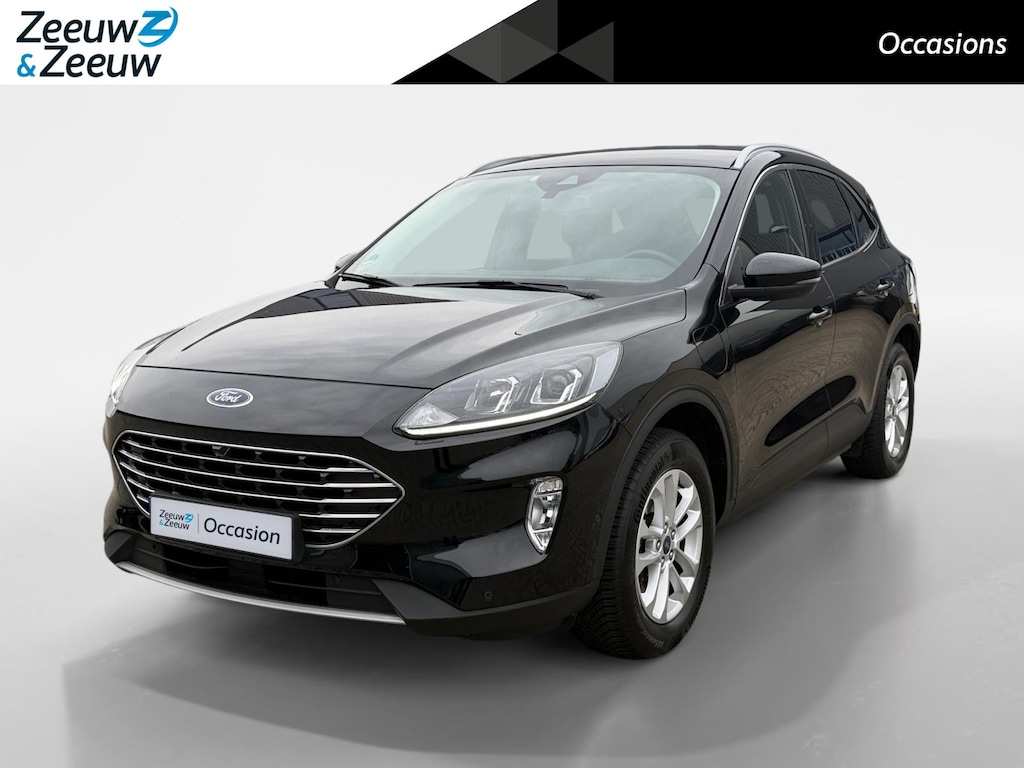 Ford Kuga 2.5 PHEV Titanium | Dealer Onderhouden | SOH 91% | El. Trekhaak | Adapt. Cruise Control | BLISS | Achteruitrijcamera | Parkeersensoren voor & achter | Winterpakket | All Season Banden