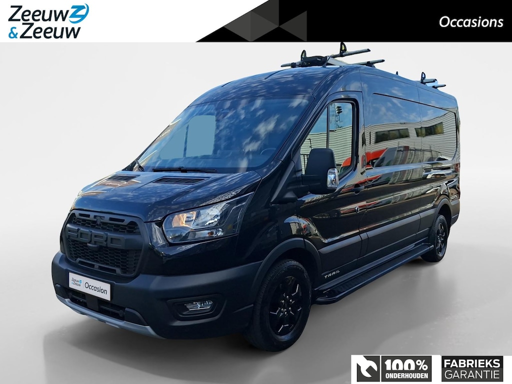 Ford Transit 350 2.0 TDCI L3H2 Trail 165 pk handgeschakeld | BPM VRIJ | Adaptive Cruise control | Navigatiesysteem | Raptor Gril | Zwarte treeplanken | LM velgen gloss black | Houten kasten links en rechts | Dakdragers met laddersysteem