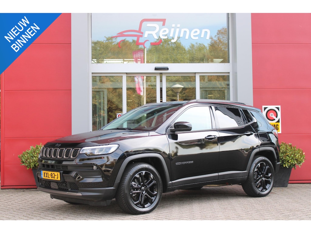Jeep Compass 4xe 240PK Plug-in Hybrid ELECTRIC UPLAND | LAGE KM STAND! | NAVIGATIE | DRAADLOZE APPLE CARPLAY/ANDROID AUTO | DRAADLOZE TELEFOONLADER | ALL SEASON BANDEN | KEYLESS ENTRY/START | ADAPTIVE CRUISE CONTROL | FULL LED KOPLAMPEN | 17" LICHTMETALEN VELGEN | CLIMATE CONTROL | DAB+ RADIO |