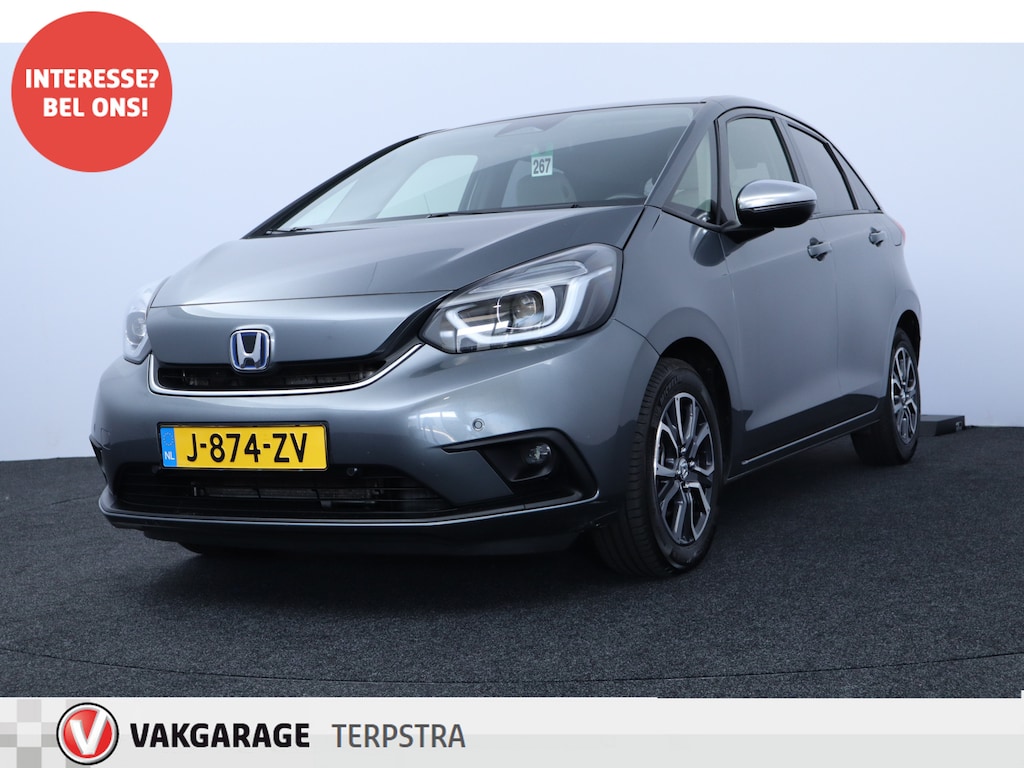 Honda Jazz 1.5 e:HEV Executive/ LED Koplampen/ Camera/ Apple + Android/ DAB+/ Stoelverw./ Lane-Assist./ Adaptive Cruise/ Dode-Hoek DET./ Keyless/ Navi/ Multi. LEDER. Stuur/ PDC V+A/ Extra getint glas.