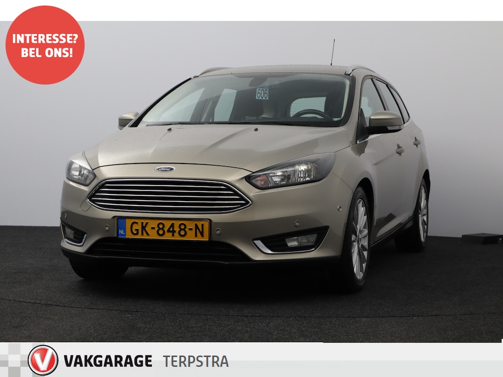 Ford Focus Wagon 1.0 Titanium Edition/ Voorruitverw./ 17'' LMV/ PDC V+A/ Navi/ Clima/ Cruise/ Elek. pakket/ Isofix/ Bluetooth/ Armsteun/ Multi. LEDER. Stuur/ Mistl./ Chroom/ Dakrails.