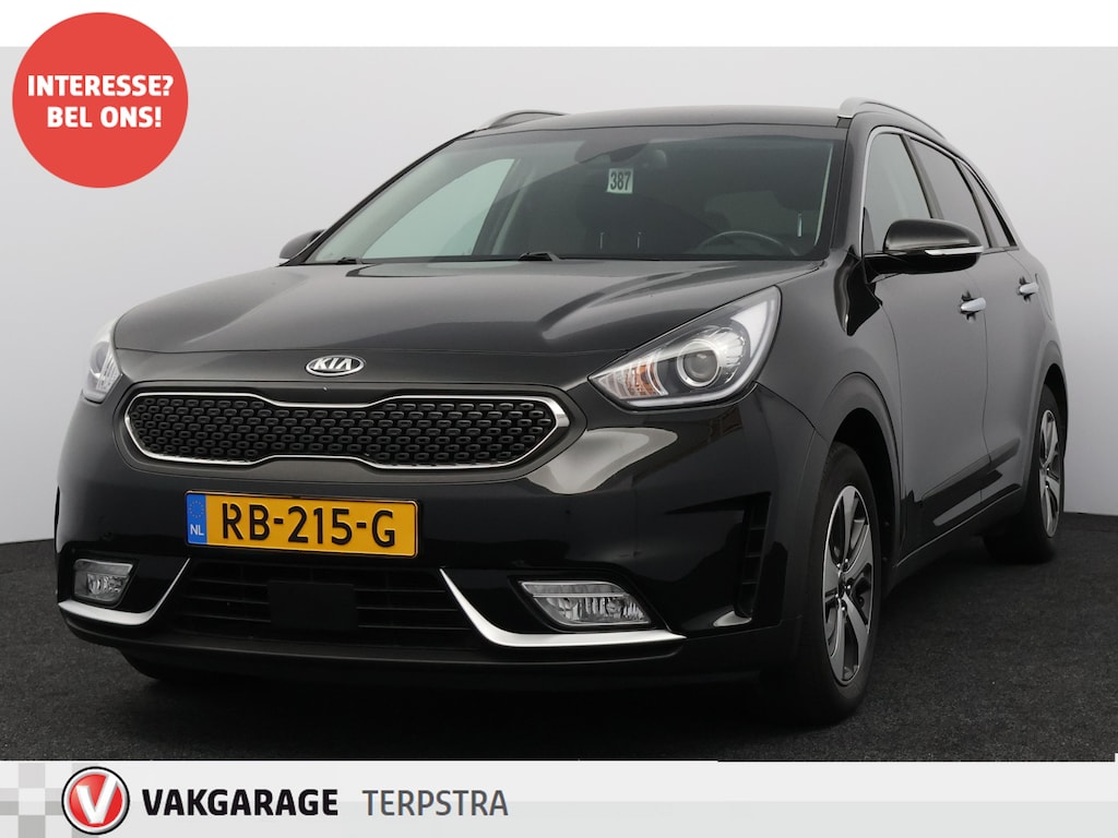 Kia Niro Hybrid 1.6 GDi DynamicLine/ Automaat/ Half-Leder/ Apple + Android/ Lane-Assist./ Camera/ Navi/ Clima/ Cruise/ Elek. pakket/ Isofix/ Multi. LEDER. Stuur/ Mistl./ Extra getint glas/ Chroom/ LED Dagrijverl.