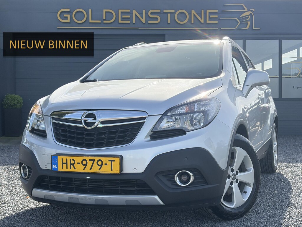 Opel Mokka 1.4 T Cosmo ✓1e Eigenaar✓Pano✓Camera✓Navi✓Leder✓Stoelverwarming✓Leder✓Trekhaak✓Dealer Onderhouden✓Pdc V+A✓6 Bak✓141pk✓Recent beurt gehad✓Bj 12-2015✓N.A.P✓Apk tot 01-2027