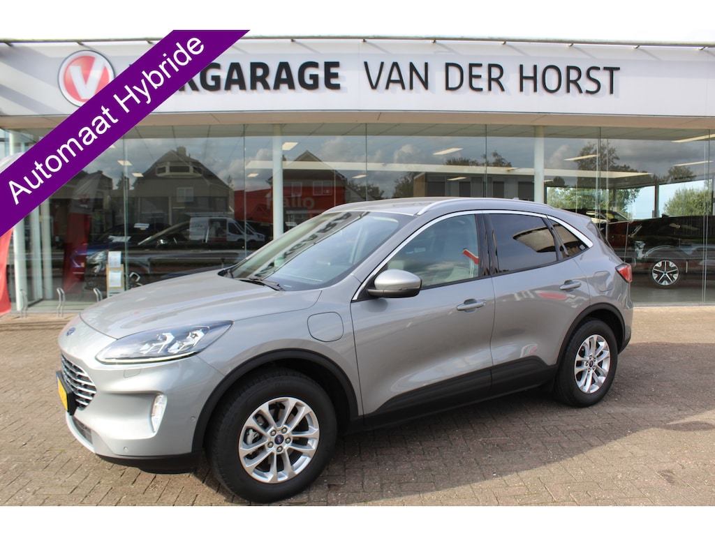 Ford Kuga 2.5-225pk PHEV Titanium X. Luxe hybride rijden voor een reëel bedrag ! Adapt. Cruise Cntrl, Climate Cntrl, Naviagtie, Telefoonvoorb., Keyless entry/keyless go, Stoel- en voorraamverw., Camera v+a, Metallic lak, Elektr. achterklep etc.
