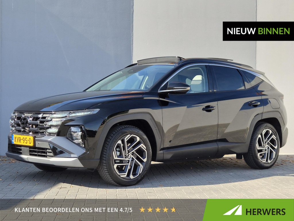 Hyundai Tucson 1.6 T-GDI PHEV Premium Sky 4WD / Dealer onderhouden / All season banden / Glazen schuif- en kanteldak / Head Up Display / Trekgewicht 1210 kg / Stuur- Stoel & Achterbankverwarming / Achteruitrijcamera / Stoelventilatie /