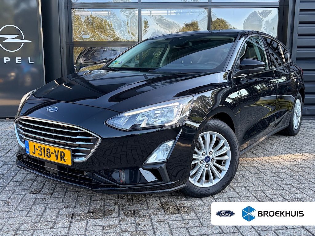 Ford Focus 1.0 Hybrid Titanium X | AGR COMFORTSTOELEN| DODEHOEK DETECTIE| NAVIGATIE + APPLE CARPLAY/ANDROID AUTO| KEYLESS ENTRY & START| CAMERA + PARKEERSENSOREN| LED KOPLAMPEN| DRAADLOZE TELEFOONLADER| BROEKHUIS ONDERHOUDEN|