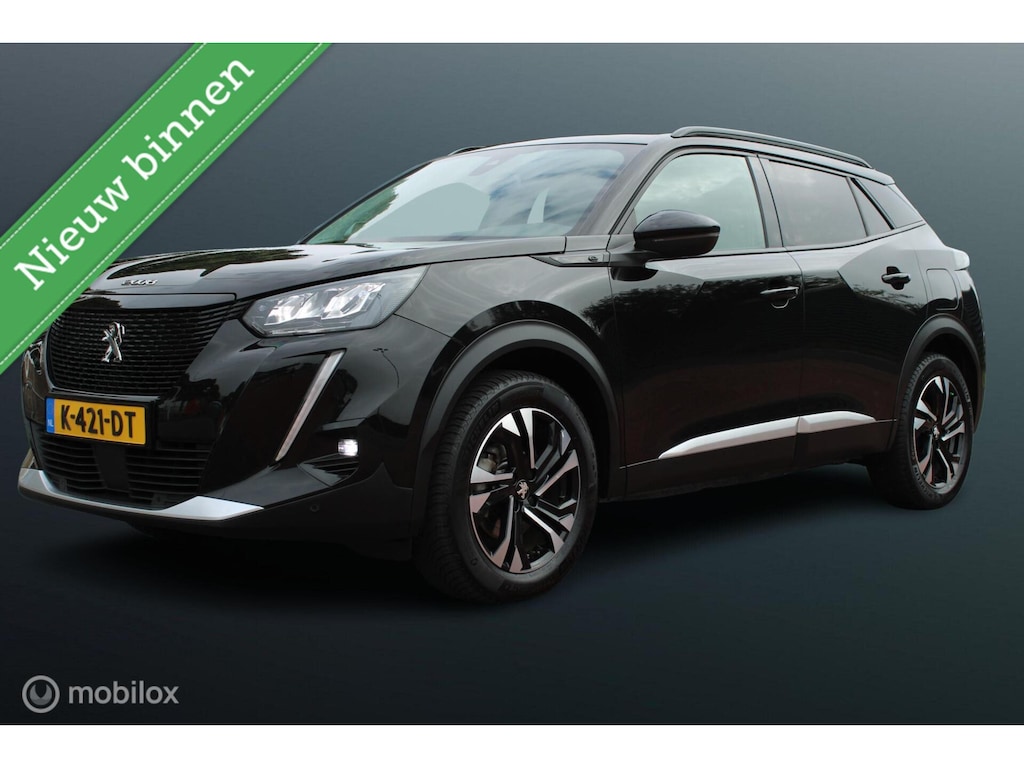 Peugeot e-2008 EV Allure 50 kWh, Navi, App connect, Cruise, Clima, Pdc + Camera, Donker glas, All Season banden