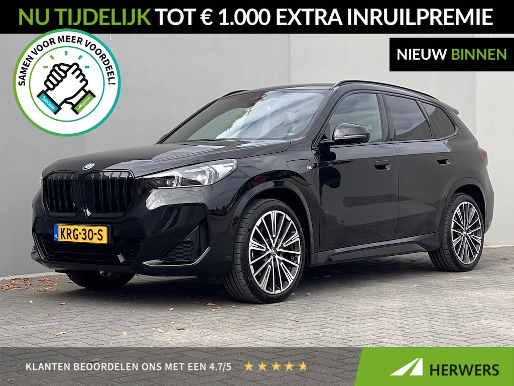 BMW X1 xDrive30e / Dealer onderhouden / Accu SoH 96 % / M-SPORT / 240 KW Plug In / 1.800 kg Elektrische trekhaak / Leder / HUD / Camera 360° / Stuur- & stoelverwarming / Navi / Apple Carplay Android / 18" LM wielen /