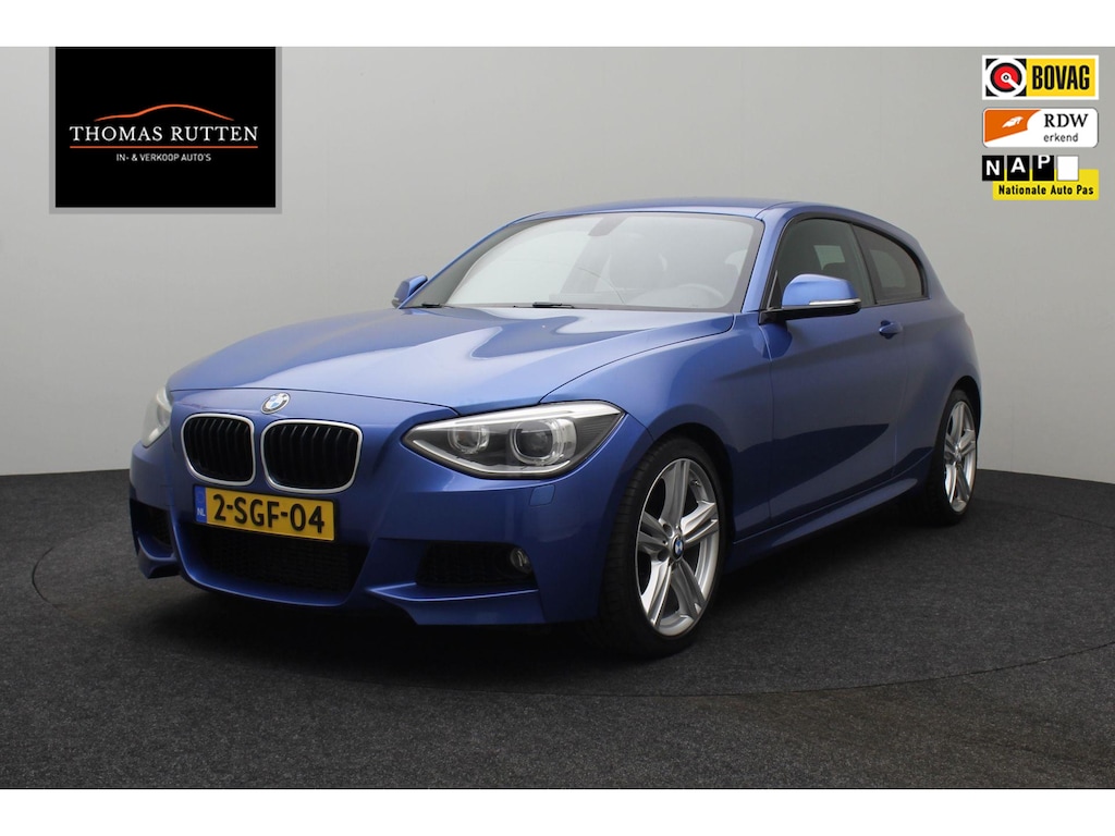 BMW 1-Serie 118i High Executive 2013 | Navigatie | Harman Kardon | Cruise Control | Airco | Stuurwiel Bediening | Stoel Verwarming | DAB Radio | Parkeersensoren | Nationale Autopas