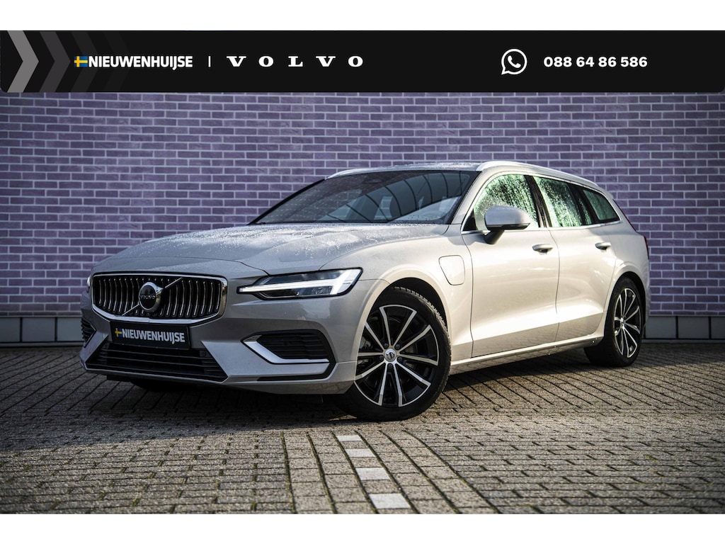 Volvo V60 T6 Plug-in Hybrid AWD Essential Bright | PHEV Long Range | SOH 99% | Trekhaak | Lederen Bekleding | Achteruitrijcamera | Parkeersensoren | Stoelverwarming voor en achter | Cruise Control Adaptief | BLIS | Google Navigatie | Apple Carplay | Android Auto