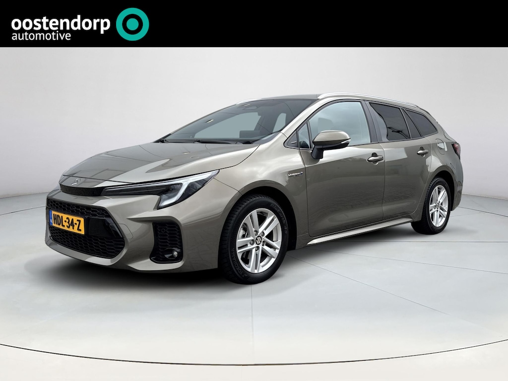 Toyota Corolla TS 1.8 Hybrid Style | Rijklaarprijs | Stoel- stuurverwarming | Navigatiesysteem | Parkeersensoren voor- en achter | Adaptieve Cruise Control | Climate Control | All Seasonbanden | Automaat |
