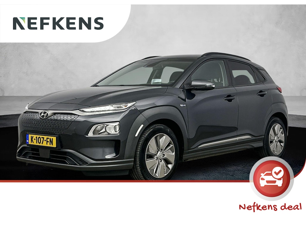 Hyundai Kona Fashion 64kWh | 1ste eigenaar | ACCU 100% | Dodehoekdetectie | Camera | AppleCarPlay/Android | AUTOMAAT