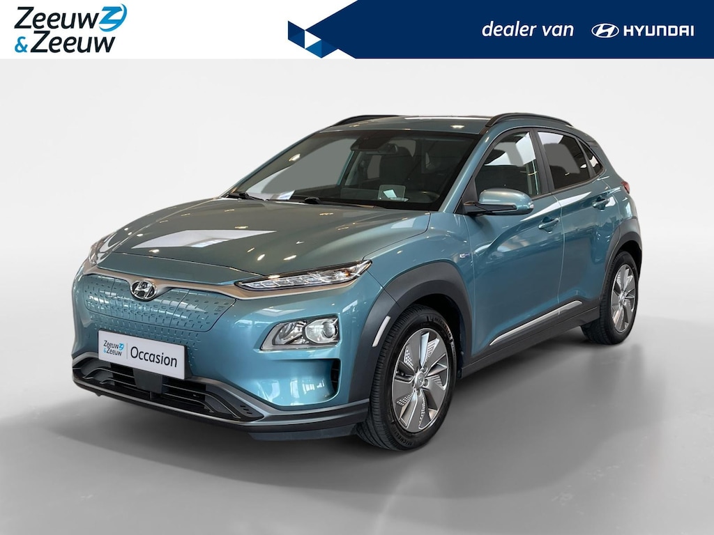 Hyundai Kona Electric EV Fashion 64 kWh 204PK | Warmtepomp | Navigatie | Apple Carplay & Android Auto | 100% SOH | Adaptive cruise control | Climate control | Head-up display | Parkeersensoren achter |