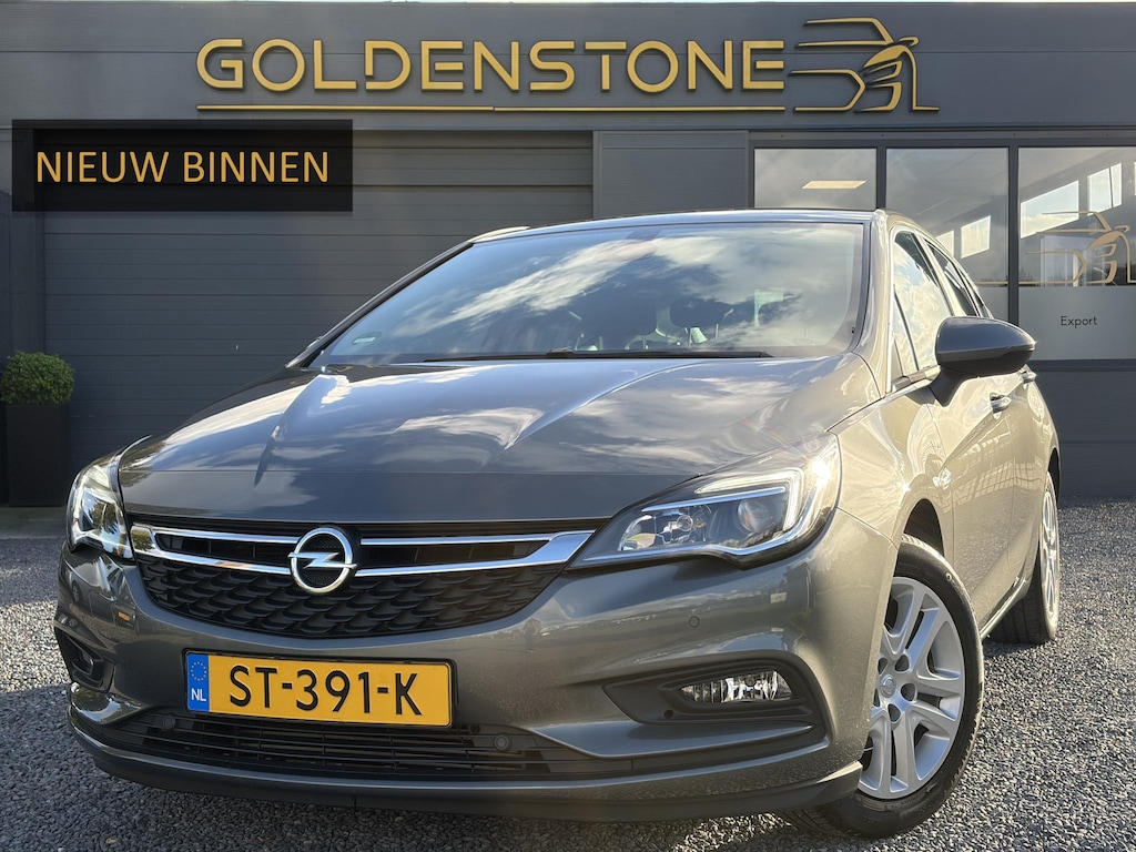 Opel Astra 1.0 Online Edition ✓2e Eigenaar✓Trekhaak✓Carplay✓Dealer Onderhouden✓Navi✓105pk✓Pdc V+A✓Clima✓Cruise✓Lm velgen✓N.A.P✓Apk tot 05-2027