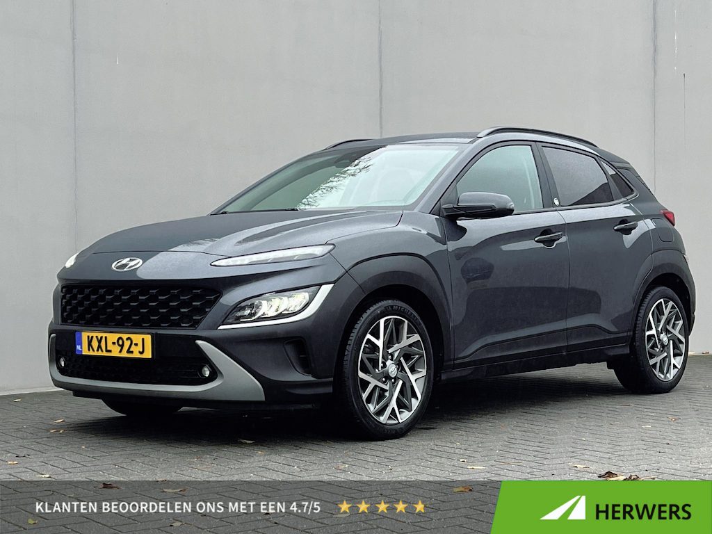 Hyundai Kona 1.6 GDI HEV Comfort Smart / Dealer onderhouden / Fabrieksgarantie tot 03-2027 / Navigatie / Apple Carplay Android / Stuur- & stoelverwarming / Krell audio / 18" LM wielen /