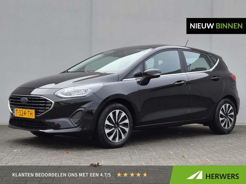 Ford Fiesta 1.0 EcoBoost Hybrid Titanium / Navigatie via Apple Carplay of Android Auto / Stuur- Stoel & Voorruitverwarming / Cruise control / Keyless Entry/Start / Climate control / Parkeersensoren achter /