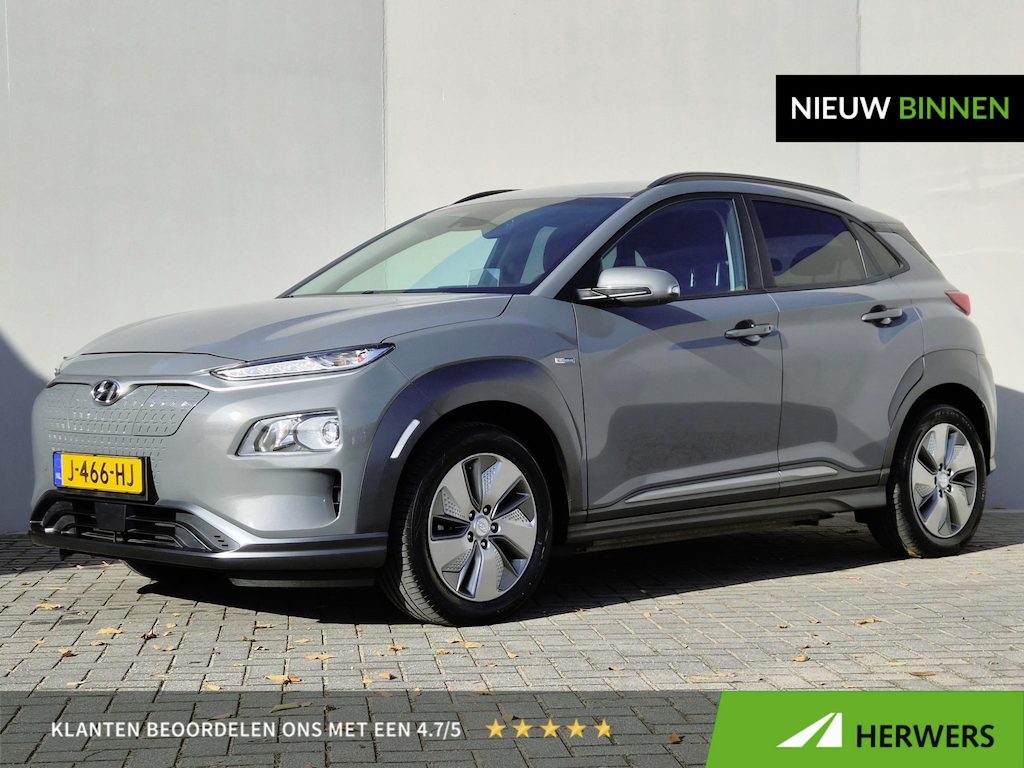 Hyundai Kona Electric EV Fashion 39 kWh / SOH 94% / Dealer onderhouden / CCS snelladen / Achteruitrijcamera / Warmtepomp / Head Up Display / Apple Carplay Android Auto / Draadloze telefoon lader / Krell Audio Systeem / Keyless Entry/Start /