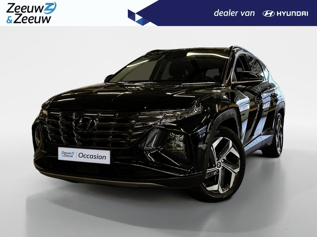 Hyundai Tucson 1.6 T-GDI PHEV Premium Sky 4WD | 66km WLTP elektrisch | Navigatie | Adaptive cruise control | Trekhaak | Apple Carplay & Android Auto | Dode hoek detectie | Draadloze telefoonlader |