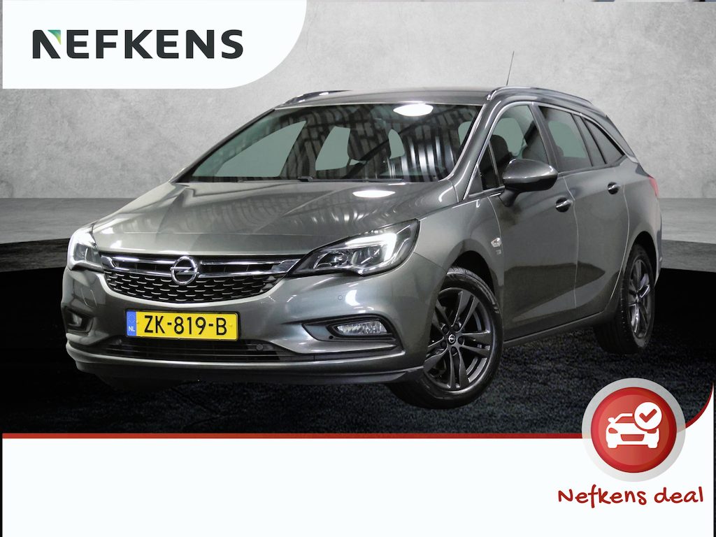 Opel Astra ST 105PK 120 Jaar Edition | 1ste eigenaar | Camera | Trekhaak | AppleCarPlay/Android | Armsteun | AGR stoelen | Navigatie | Climate Control | Cruise Control | Isofix | Privacy Glass | Parkeersensoren |