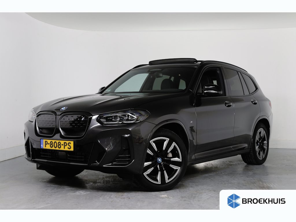 BMW iX3 Executive 80 kWh M-Sport | SOH 95% | 1e Eigenaar! | Dealer Onderhouden! | Open dak | Memory Zetels | Sfeerverlichting | Cruise Adaptive | Leder | Stoelverwarming | Camera | Clima | Navi | Keyless