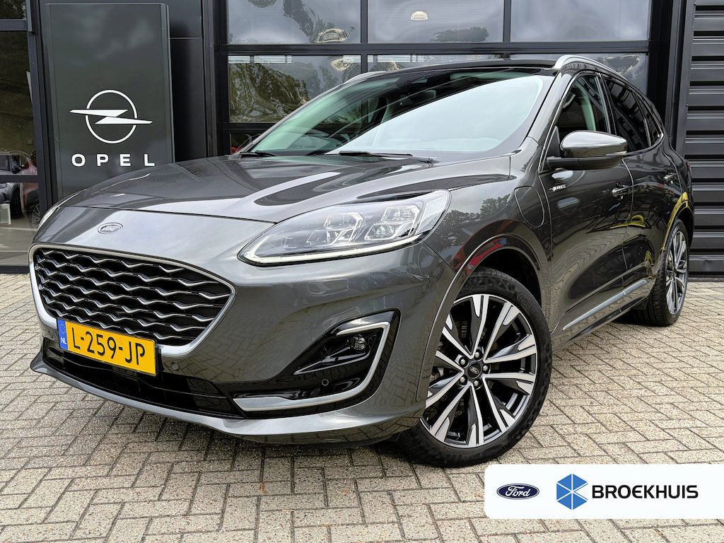 Ford Kuga 2.5 PHEV 225 PK Vignale | TREKHAAK| ELEK. SCHUIF-/KANTELDAK| LEDER MET GEHEUGEN| ELEK. ACHTERKLEP| STUUR, STOEL, VOORRUIT EN ACHTERBANK VERWARMING| KEYLESS ENTRY & START| FULL LED| NAVIGATIE + APPLE CARPLAY/ANDROID AUTO| EERSTE EIGENAAR|
