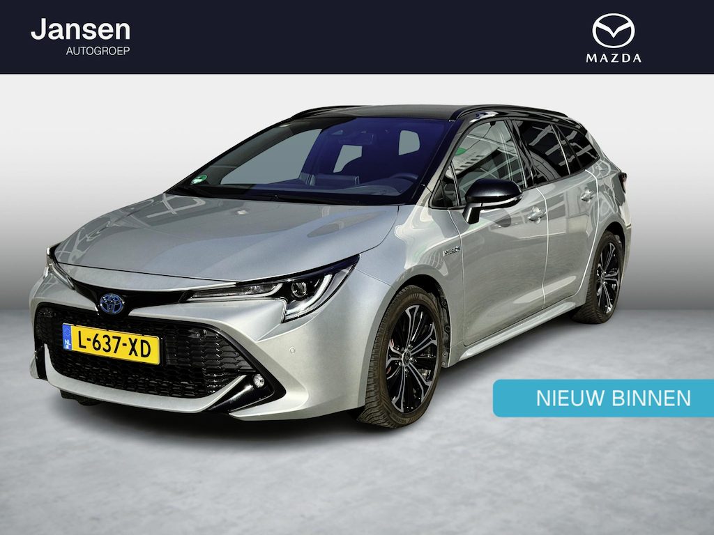 Toyota Corolla Touring Sports 1.8 Hybrid Dynamic two-tone, trekhaak, all weather banden, achteruitrijcamera, navigatie, enz.