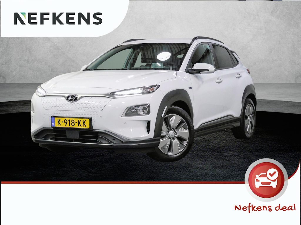 Hyundai Kona Limited 64kWh 201PK | 1ste eigenaar | ACCU 95% | LEER | AppleCarplay/AndroidAuto | Adaptief Cruise Control | Head-UP Display | Dodehoekdetectie | Camera | Stoel/Stuur/Achterbank verwarming | Stoelkoeling | AUTOMAAT | Isofix | Privacy Glass | Warmtepomp |