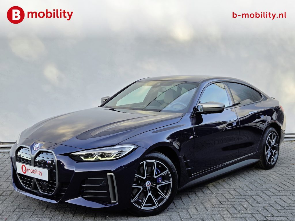 BMW i4 M50 High Executive M-Sport 84 kWh 'Tansanitblau' SOH 96% NL Auto! | 360 Camera | Hifi | DAB | Snelladen | Leer | Head-Up