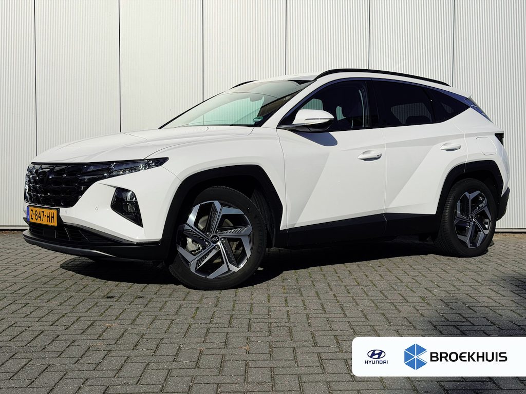 Hyundai Tucson 1.6 T-GDI PHEV Comfort Smart 4WD / Stoelverwarming / Stuurverwarming / Achteruitrijcamera / Parkeersensoren Voor + Achter / Navigatie / Apple Carplay & Android Auto / | Achteruitrijcamera | Airco (automatisch) | Apple Carplay/Android Auto|telefoonintegratie premium