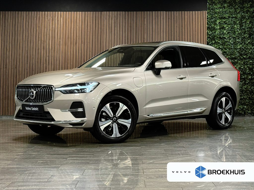 Volvo XC60 T6 AWD Recharge Plus Bright | Trekhaak | 360° Camera | Harman Kardon | Adaptieve Cruise Control | Stoelverwarming voor+achter | Stuurwielverwarming | Schuifdak | Full LED Meesturende koplampen | Pilot Assist | BLIS Dode Hoek Detectie | Elektrische voorstoelen geheugen | Lederen bekleding | Zitting verlenging voorstoelen | 19 Inch | Google Infotainment | Keyless Drive | Privacy Glass | Elektrisch bedienbare achterklep | DAB Radio | Apple Carplay/Android Auto | Draadloos telefoon opladen | Volvo On Call met mobiele App functie | Bright Dusk Metallic |