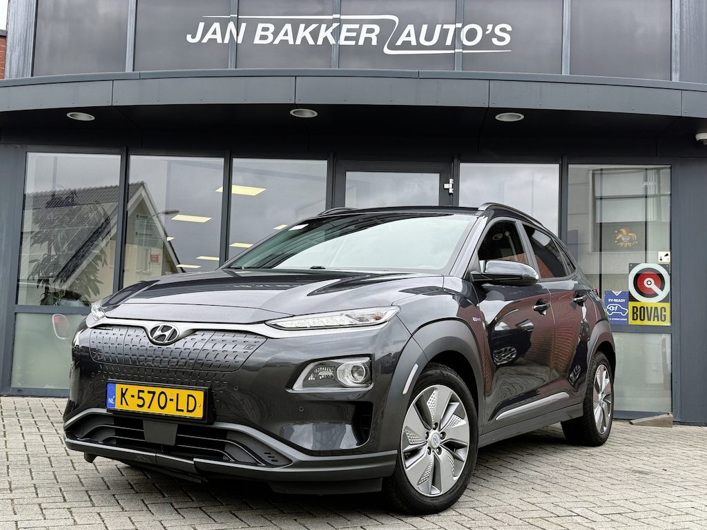Hyundai Kona Electric EV Limited 64 kWh SoH 100% ✅ Leer ✅ Camera ✅ Stuurverw. ✅ stoelverw ✅CarPlay