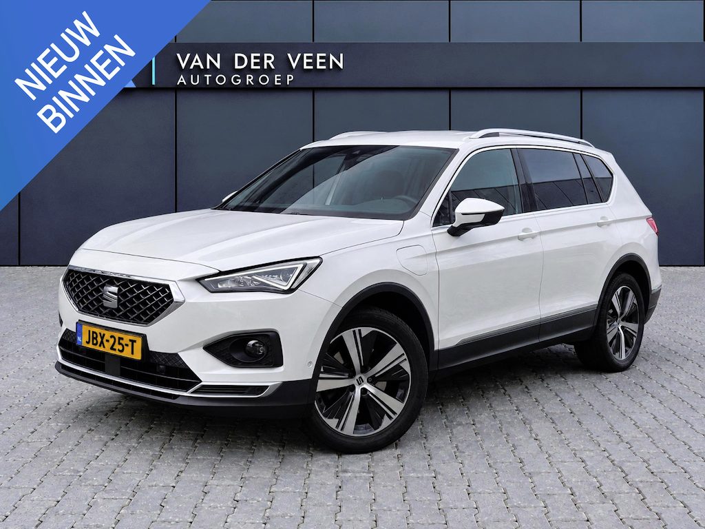SEAT Tarraco 1.4 TSI e-Hybrid PHEV Xperience Business Intense | Incl. 12 maanden Garantie | Wegklapbare trekhaak | Stoel/stuurverwarming | Achterbank verwarmd | Achteruitrijcamera | Elektrische kofferbakklep | Dodehoekdetectie | Adaptive cruise controle | Climate controle | Apple CarPlay/Android Auto | Keyless entry/start | DAB | Navigatie | Parkeersensoren V+A |