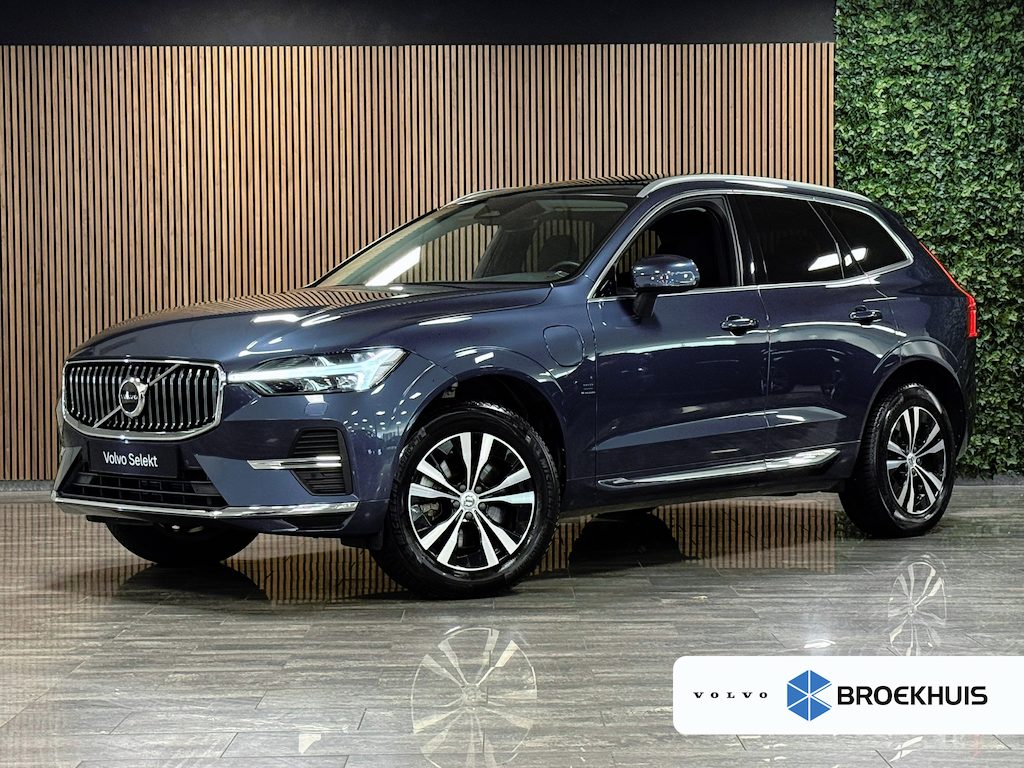 Volvo XC60 T6 AWD Recharge Bright Long Range | Trekhaak | All Season banden | Adaptieve Cruise Control | Stoelverwarming voor+achter | Stuurwielverwarming | Full LED Meesturende koplampen | Standkachel met Volvo On Call App | Pilot Assist | BLIS Dode Hoek Detectie | Lederen bekleding | Schuifdak | Parkeercamera | Google Infotainment | 18 Inch | Keyless Drive | Parkeersensoren voor+achter | Privacy Glass | Automatisch dimmende binenn en buitenspiegels | Regensensor | Climate Controle L+R | DAB Radio | Apple Carplay/Android Auto | Draadloos telefoon opladen | Volvo On Call met mobiele App functie | Denim Blue Metallic |
