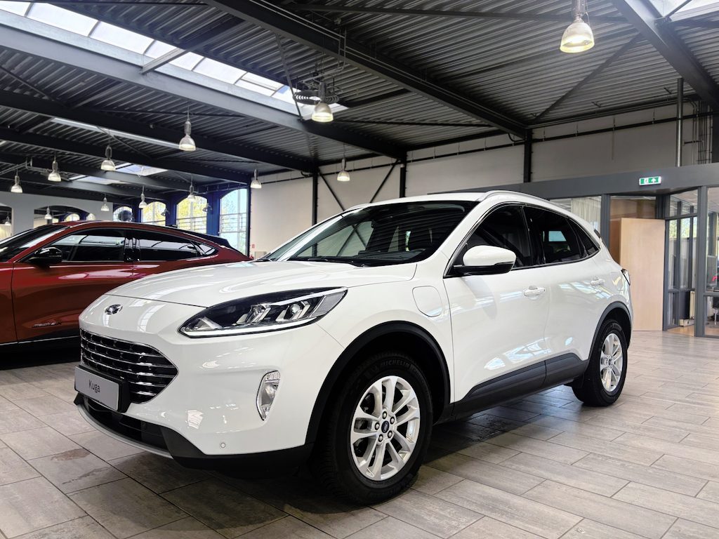 Ford Kuga 2.5 PHEV 225 pk Titanium | Trekhaak | Winter Pack | El. a. klep | Camera | SOH 98,3% | 100% dealer onderh. | 4 seiz. banden