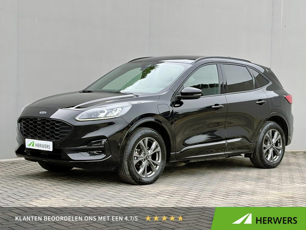 Ford Kuga 2.5 PHEV ST-Line X / Dealer onderhouden / Trekgewicht 1.500 kg / Navigatie / Stuur-, stoel- & achterbankverwarming / Parkeer assistent/ Camera 360°  / Elektrische stoel & klep / 18" LM wielen / Adaptief cruise control / Apple Carplay Android Auto /