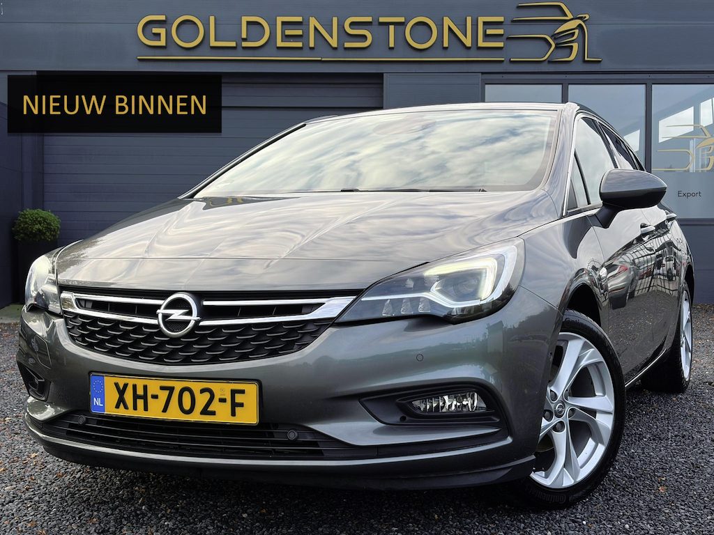 Opel Astra 1.4 Innovation ✓2e Eigenaar✓Carplay✓Keyless✓Camera✓Halfleder✓Navi✓Clima✓Cruise✓150pk✓Pdc V+A✓Rijstrooksensor✓6 Bak✓Dodehoeksensor✓17''Lm velgen✓Recent Beurt gehad✓N.A.P✓Nieuwe Apk bij Aflevering