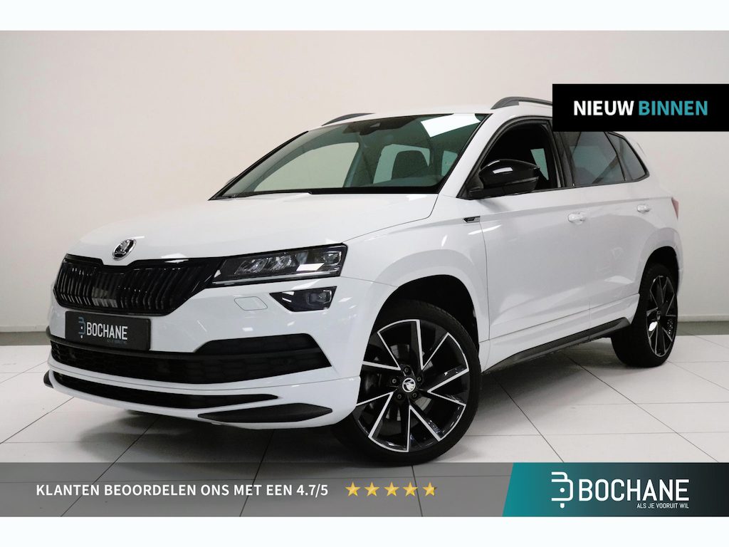 Skoda Karoq 1.5 TSI ACT Sportline Business | Canton audio | Camera | Trekhaak | Cruise control | Navigatie | Stuur & stoelverwarming |