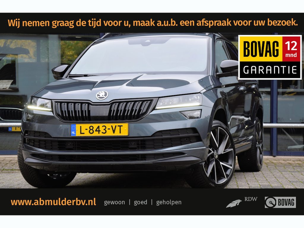 Skoda Karoq 1.5 TSI 150PK ACT Sportline Business DSG Automaat | Org. NL | BOVAG Garantie | Trekhaak | Panoramadak | Camera | 19'' Velgen | Canton | Stoel/Stuur/Voorruitverwarming | Adaptive Cruise Control |