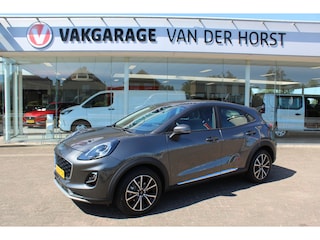 Ford Puma 1.0-125pk EcoBoost Hybrid Titanium. Garantie t/m 21-05-2027 ! Slechts 14.750km ! Volautm. airco, metallic lak, stoel-, stuur- en voorraamverwarming, navigatie, telefoonvoorbereiding, elektrische achterklep, cruise cntrl, keyless entry / keyless go etc.