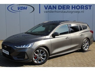 Ford Focus Wagon 1.0-125pk EcoBoost ST-Line X. Geweldig mooie, luxe en sportieve Focus wagon ! Slechts 12.000km ! Autm. airco, stoel-, stuur- en voorraamverw., ergonomische stoelen, adaptieve cruise cntrl, side- en lane assist, elektr. panodak, B&O soundsyst., etc.