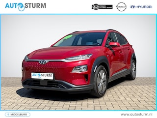 Hyundai Kona EV Premium 64 kWh | Head-Up Display | Navigatie | Camera | Leder | Adapt. Cruise Control | Stuur- + Stoelverwarming | Rijklaarprijs!