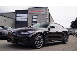 BMW i4 EDrive40 High Executive | Schuifdak | M-pakket | Laserlight | Iconic Sound | Driving Assistant Professional | BTW AUTO |