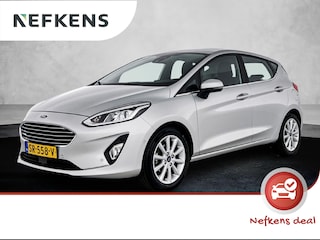 Ford Fiesta Titanium 100 pk | Navigatie | Achteruitrijcamera | Parkeersensoren Voor en Achter | Sportstoelen | LED Dagrijverlichting | Lederen Stuurwiel en Versnellingspook | Climate Control | Adaptieve Cruise Control | 16" Lichtmetalen Velgen | Apple Carplay/Android Auto |